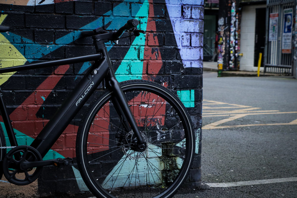 Falcon Zone Electric Hybrid Bike - against a street art mural — view 25