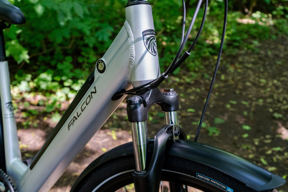 Falcon Horizon Low Step Electric Hybrid Bike - suspension fork and head badge — view 17