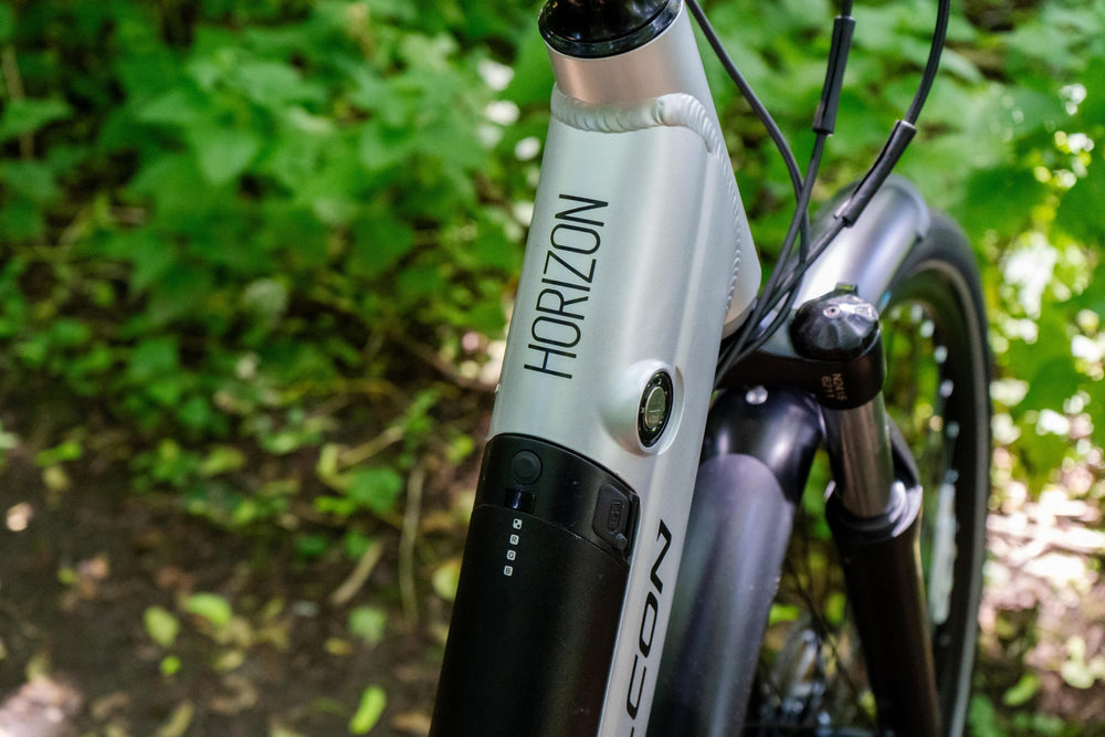 Falcon Horizon Low Step Electric Hybrid Bike - head tube and integrated battery — view 12