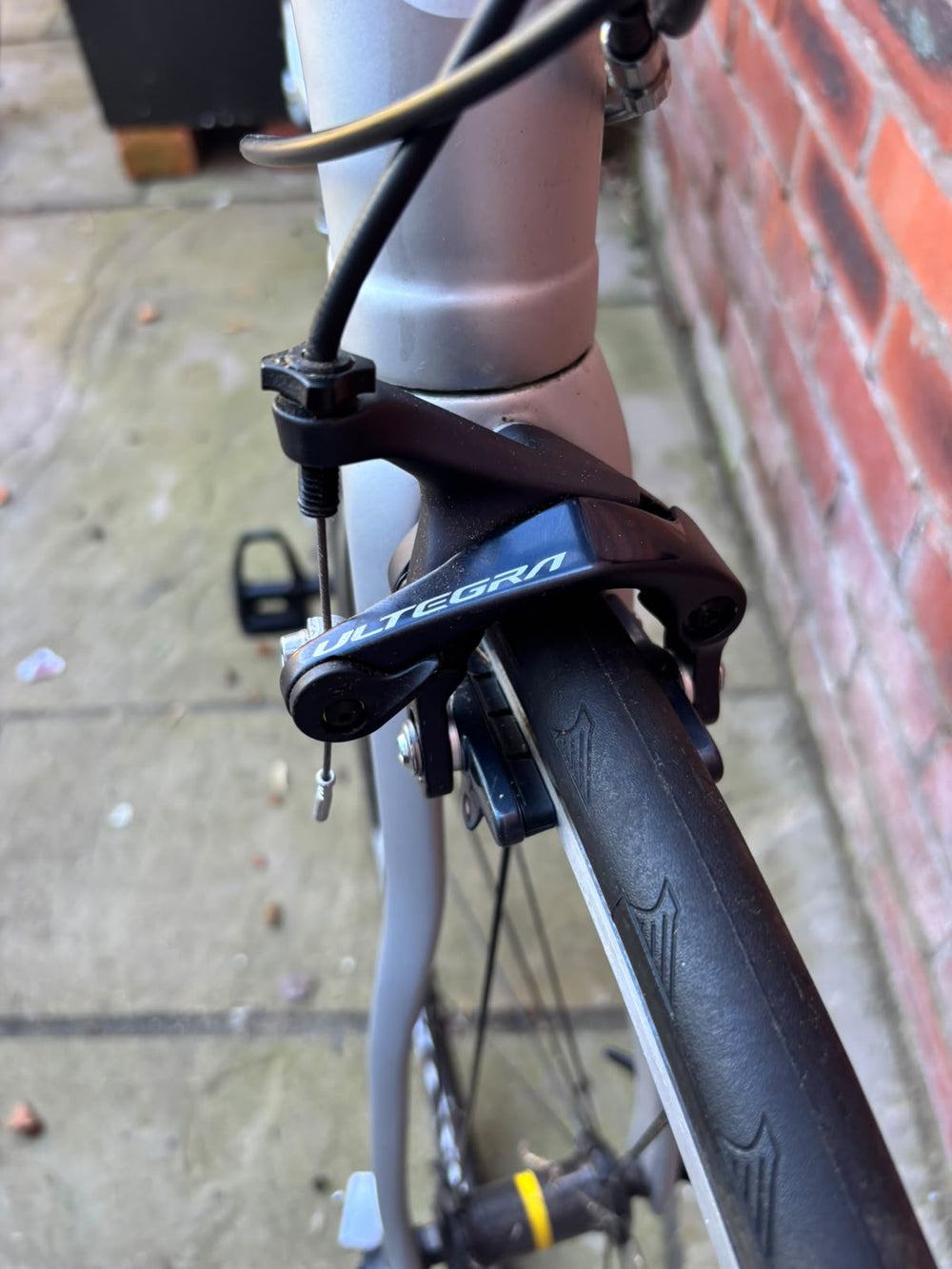 Shimano Ultegra front rim brake caliper and Continental tyre on the Ribble road bike — view 8