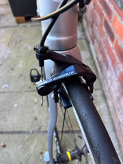 Shimano Ultegra front rim brake caliper and Continental tyre on the Ribble road bike — view 8