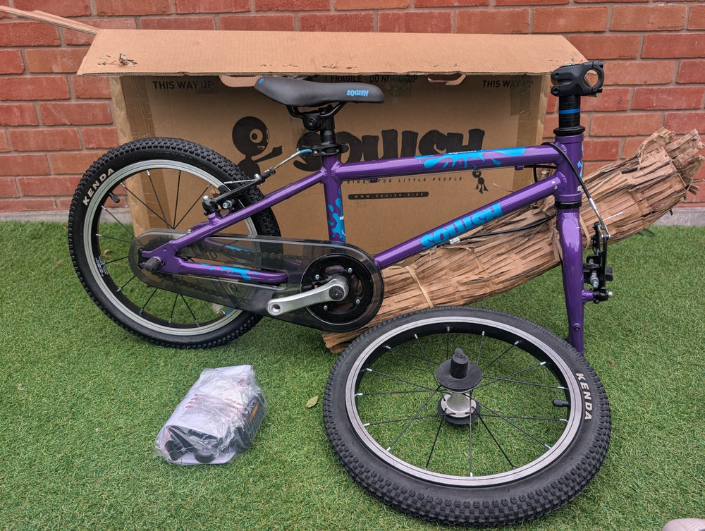 Squish 16" Purple, minor mark - this bike, side view with its box — view 2