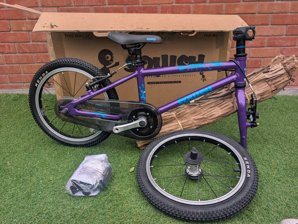 Squish 16" Purple, minor mark - this bike, side view with its box
